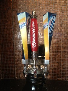 a beer tap with a red and blue handle