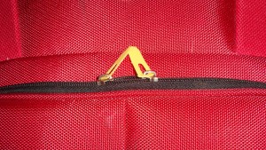 a yellow plastic object in a red bag